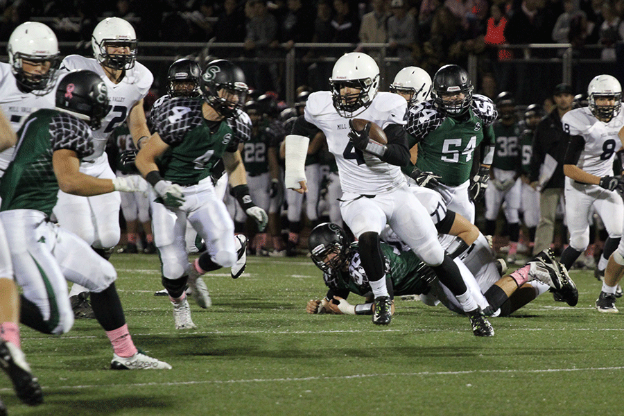 Junior quarterback Logan Koch runs for a first down in the Jaguars loss to the Staley Falcons, on Friday, Oct. 3.