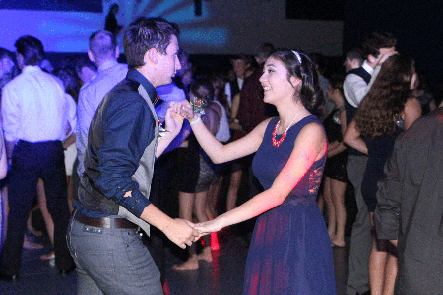 Sophomore Natalie Carrera and senior Austin Moore dance together at the Homecoming dance on Saturday, Oct. 11.