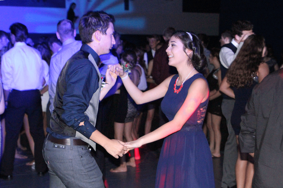 Sophomore+Natalie+Carrera+and+senior+Austin+Moore+dance+together+at+the+Homecoming+dance+on+Saturday%2C+Oct.+11.