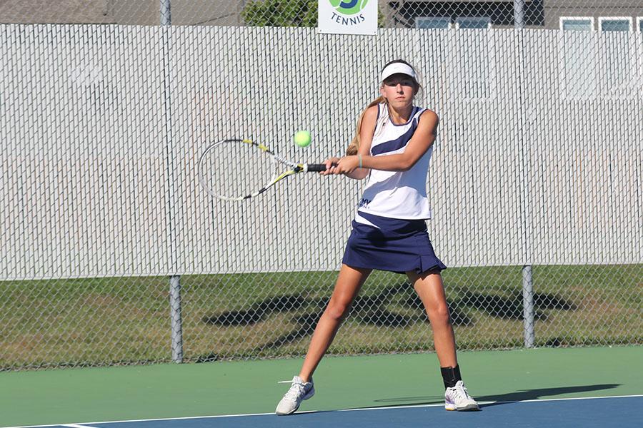 Sophomore Lauren Tracht returns the ball to her opponent during the girls tennis meet against Blue Valley Southwest on Tuesday, Oct. 7. The girls fell to the Timberwolves 1-8. 