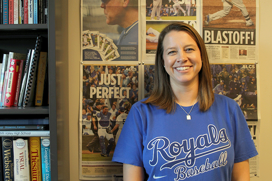 Showcasing recent newspapers highlighting the Royals' performance in her classroom, English teacher Ashley Agre claims herself as a super-fan. 