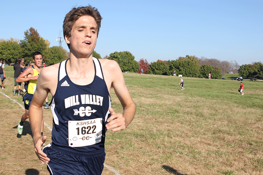 Pacing himself in the last 50 feet of the race, senior Kurt Loevenstein qualified for state cross country along with boys cross country runners junior Derek Meeks and junior Garret Fields and girls cross country runner junior Amber Akin on Saturday, Oct. 25. 