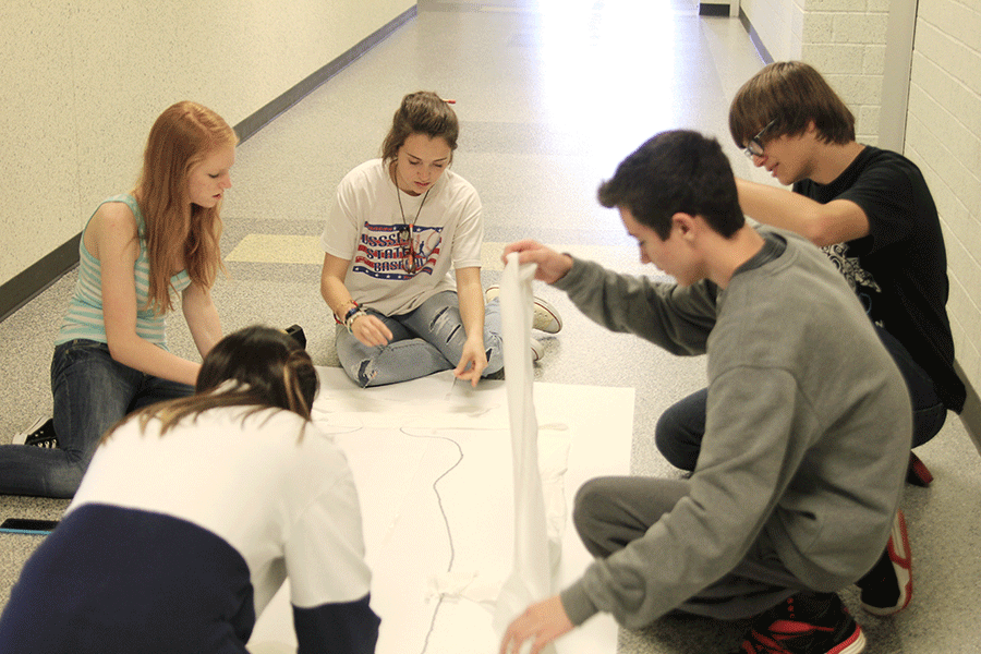 To participate in Red Ribbon Week, students from social studies teacher Mike Roushs seminar class decorate their door according to the anti-drug and alcohol theme. Our door has a mummy on it and [the message of our door] is drugs and alcohol are deadly, sophomore Savannah Chappell said.