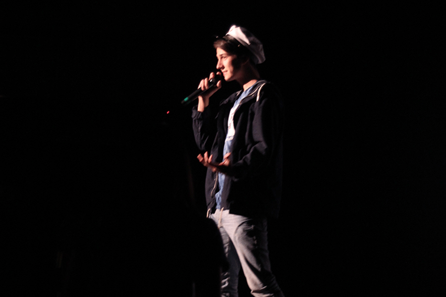 While speaking at the Halloween Film Fest. senior Caleb Latas introduces the films.