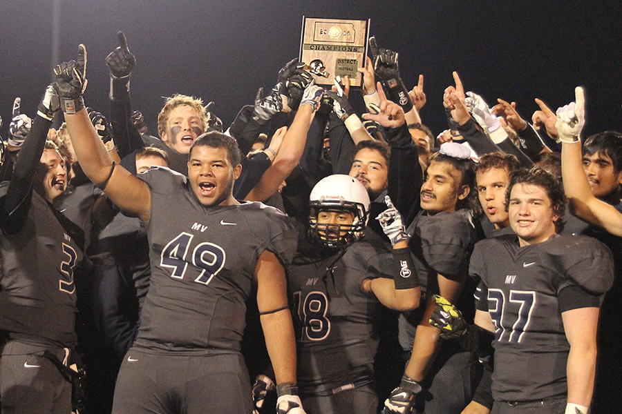 Receiving a trophy, the Jaguars earn the title District Champions after their game against the Turner Bears on Friday, Oct. 31. They end the regular season with a record of 5-4.