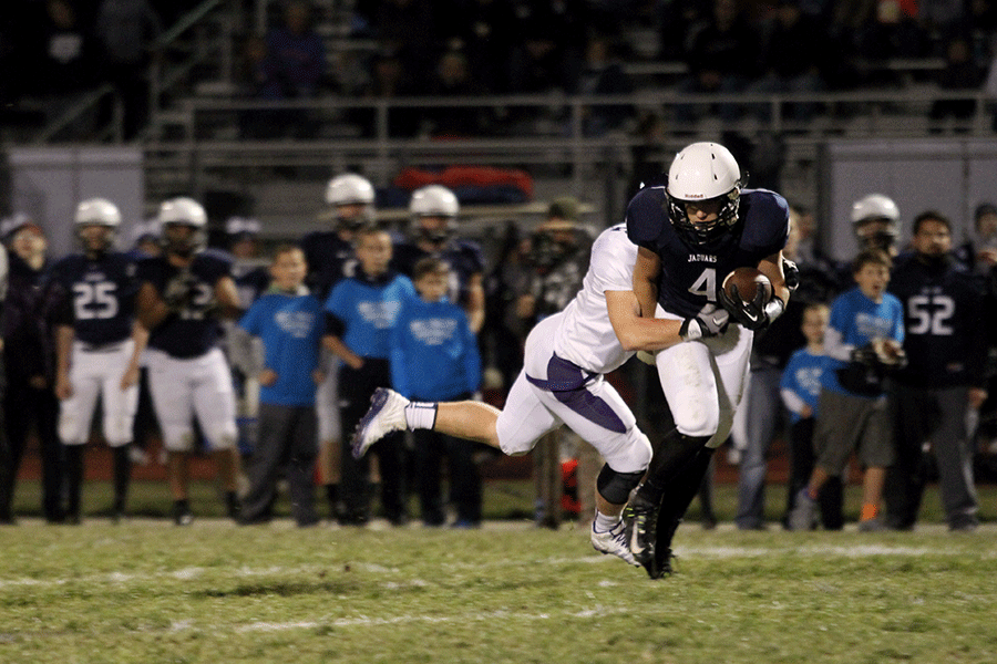 Junior Logan Koch runs the ball during the regional game against Pittsburg High School on Friday, Nov. 7. The team lost 42-21 and finished the season with a record of 5-5. 