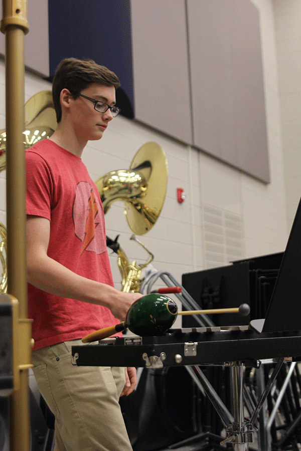 As part of the Silver 4 class, senior Tyler Ferren performs for a student and teacher audience in the Percussion Ensemble on Wednesday, Dec. 10. Many of the Percussion Ensemble students are beginner percussionists and not band members. 