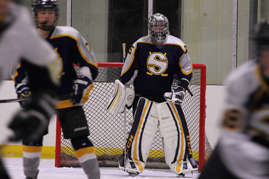 Sophomore Bryce Hart, goalie for the Kansas City Fighting Saints, guards the goal in a game against Springfield Spirit at Bode Ice Arena on Saturday, Dec. 6. 
