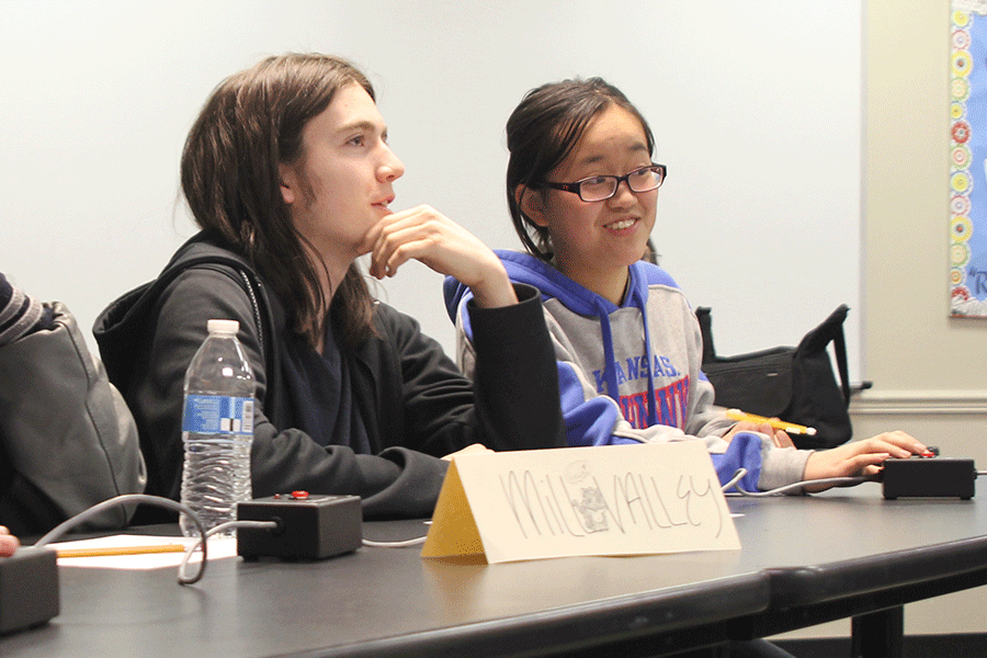At the Quiz Bowl tournament at De Soto High School on Tuesday, Dec. 2, junior Ryan Schwaab and T-Ying Lin discuss any possible answers. 