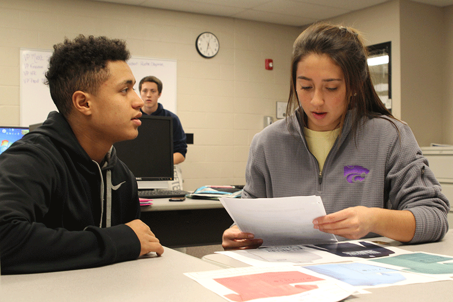 In her Advanced Marketing class, senior Lauren Mansfield continues her work for DECA on Monday, Dec. 8. “When we go to competitions there’s so many people there but we’re all doing different things,” Mansfield said. “I love going to my event, which is hotel lodging and management. I love traveling, so when I go to my event I’m talking about something that I love.”