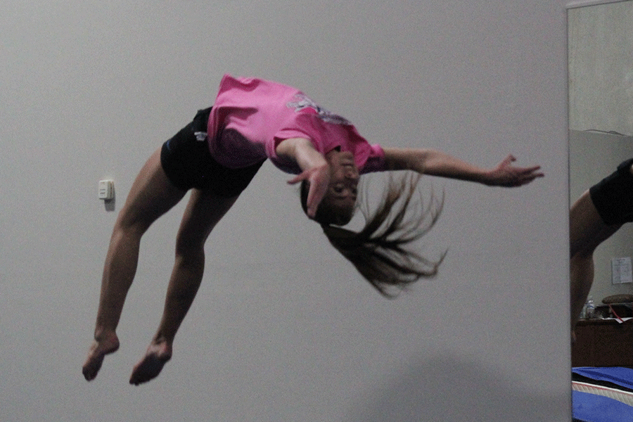 As sophomore Brooke Carson begins another strenuous round of tumbling, she keeps a positive attitude at Miss Marias Acrobat Studio on Monday, Nov. 3. I keep doing it to see how far I can get, Carson said. I want to push myself to be the best I can be.