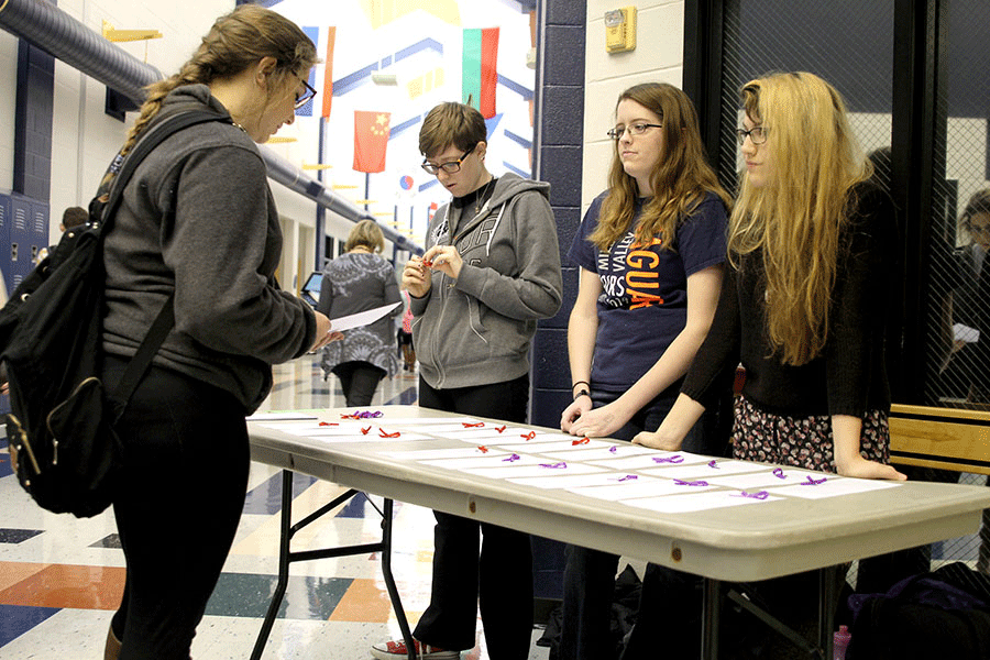 GSA members hand out support ribbons 