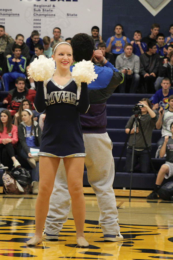 Senior Kat Murry leads the student body in the rollarcoaster at the pep assembly on Friday, Jan. 16.