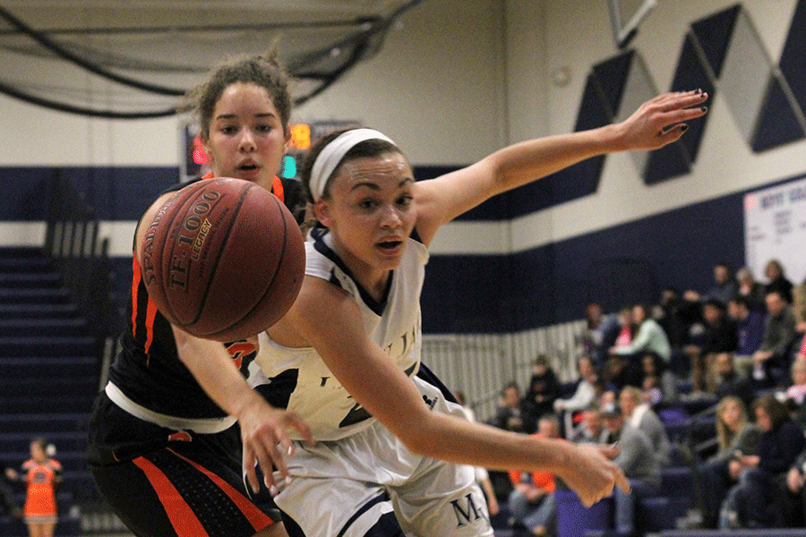 Senior Whitney Hazlett attempts to keep the ball away from a Bonner Springs Braves player on Friday, Jan. 9. The Lady Jags lost 38-28 to the Braves.