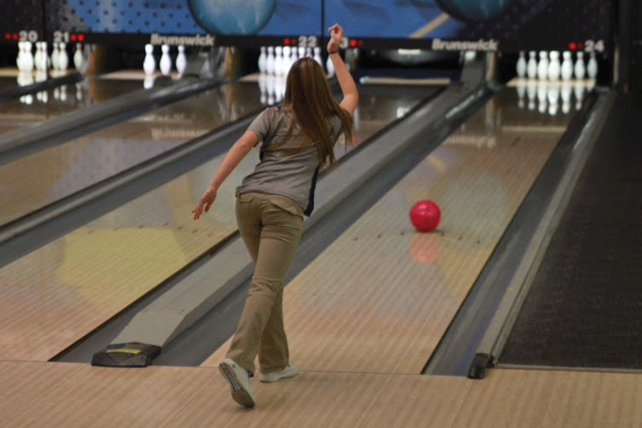 Freshman Emily Jackson rolls one of many strikes to help her team advance through the qualifying game against St. James at Royal Crest Lanes on Saturday, Jan. 10.