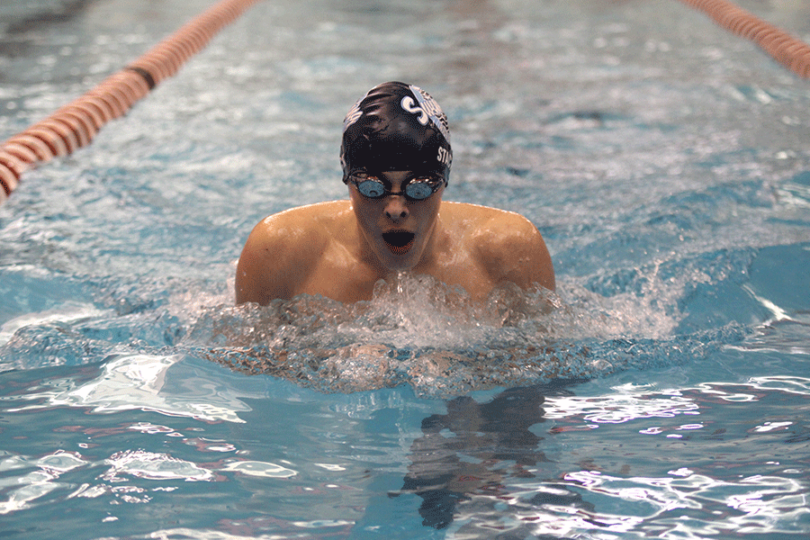 Senior Nick Stack competes in the breaststroke at Blue Valley West on Thursday, Jan. 29.