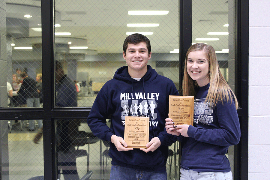 Juniors Amber Akin and Derek Meeks hold their academic all state plaques on Thursday, Jan. 22.