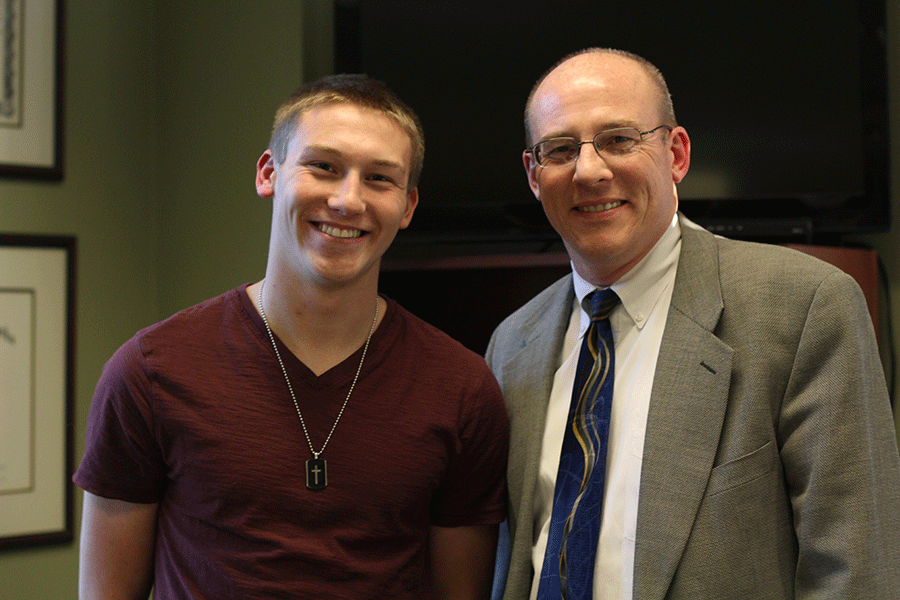 Junior Christian Howe stands with his father Steve Howe in the District Attorneys office on Wednesday, Jan. 7