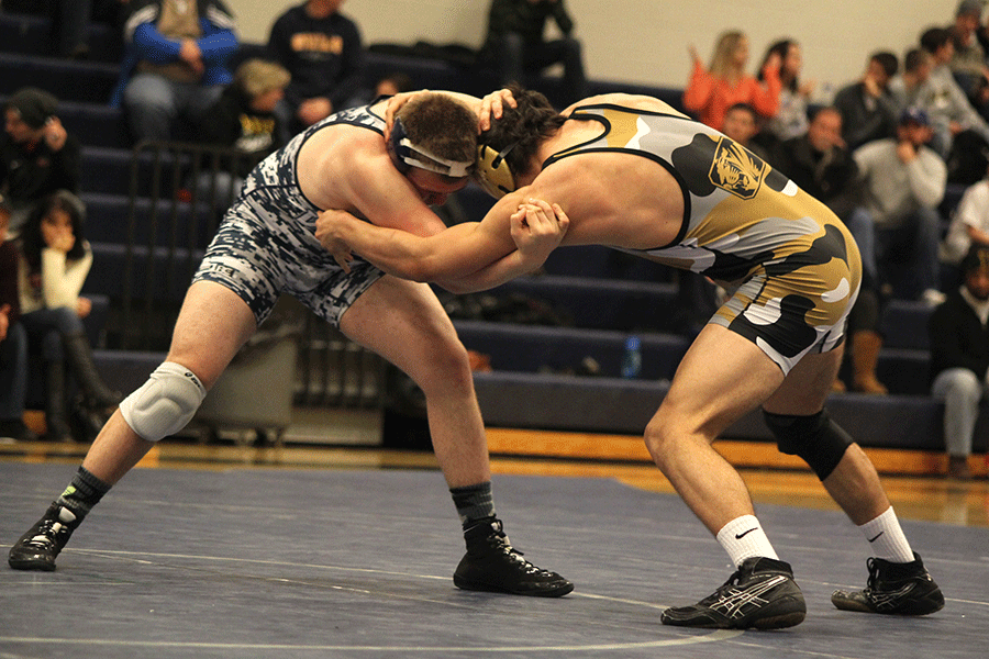 Junior Peyton Bendure wrestled  in the 172 pound weight class winning his match.