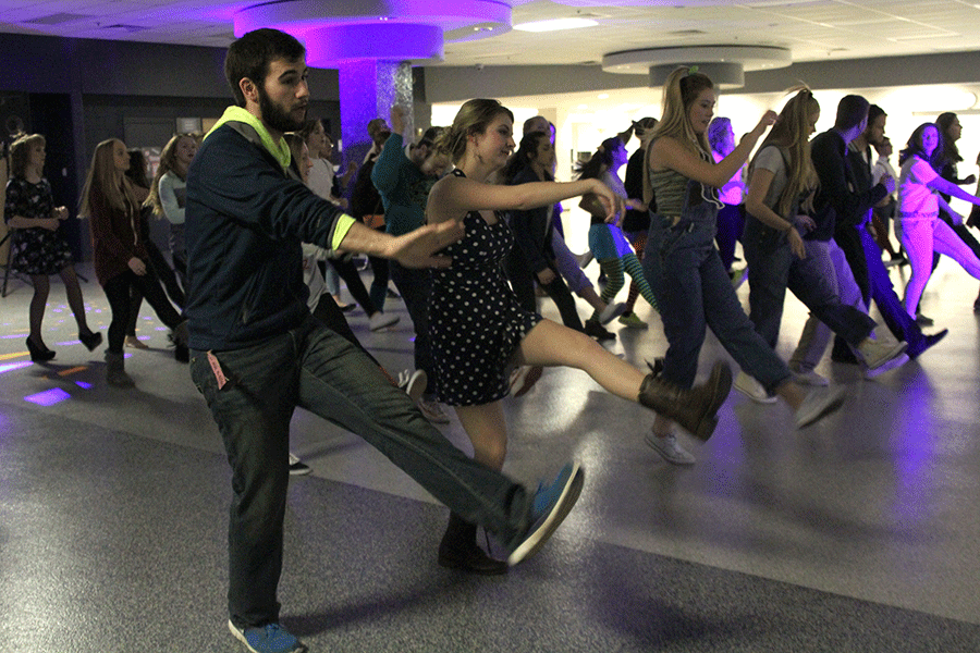 Senior Eli Stewart dances to Cupid Shuffle by Cupid during Winter Homecoming in the commons on Friday, Jan. 16.