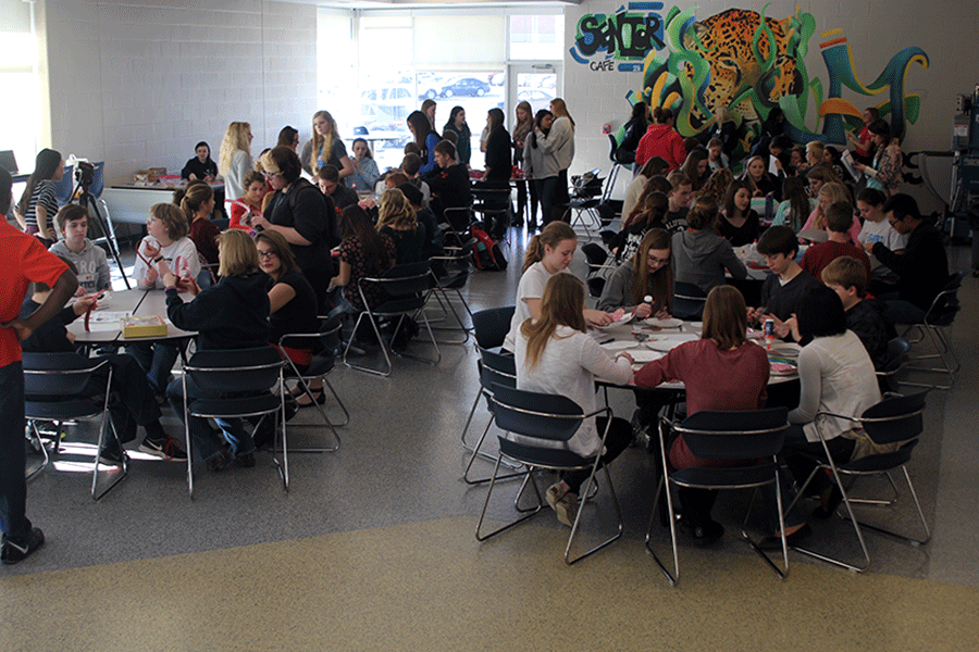 Members of MV Outreach meet in the senior cafe to create Valentines Day decorations for Childrens Mercy on Friday, Jan. 23.