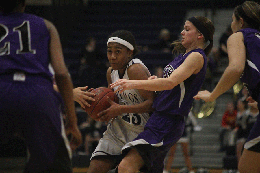 Senior Jabria Legget drives in for a shot on Friday, Feb. 20 against Piper.