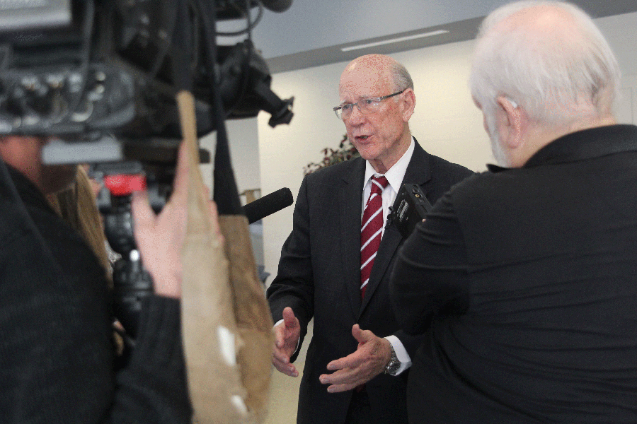 U.S. Sen. Pat Roberts is interviewed by several reporters during his visit at Mill Valley High School.