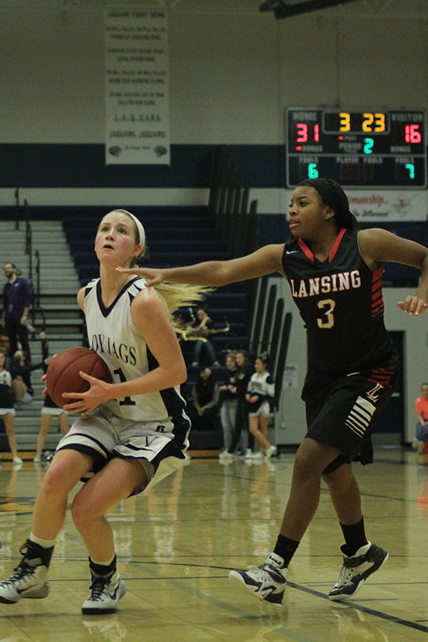 Senior Savannah Rudicel prepares to take a shot towards the basket.