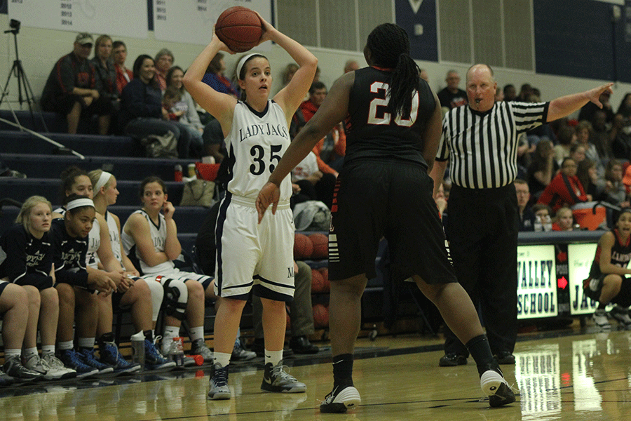 Senior Lacie Myers prepares to pass the ball to her teammate.