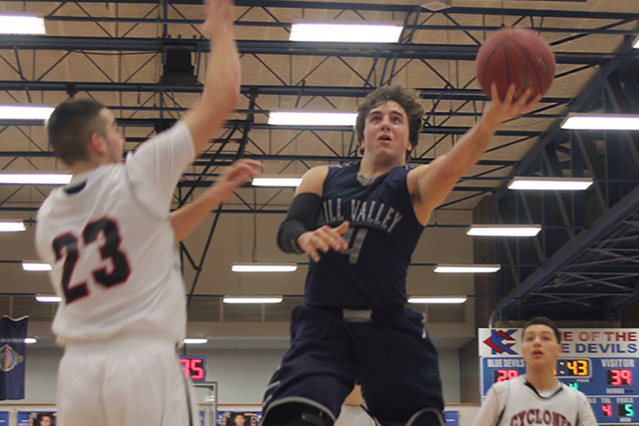 Junior Logan Koch goes up for a layup during the basketball game against Bishop Ward on Friday, Feb. 6. The Jaguars defeated the Cyclones, 57-35