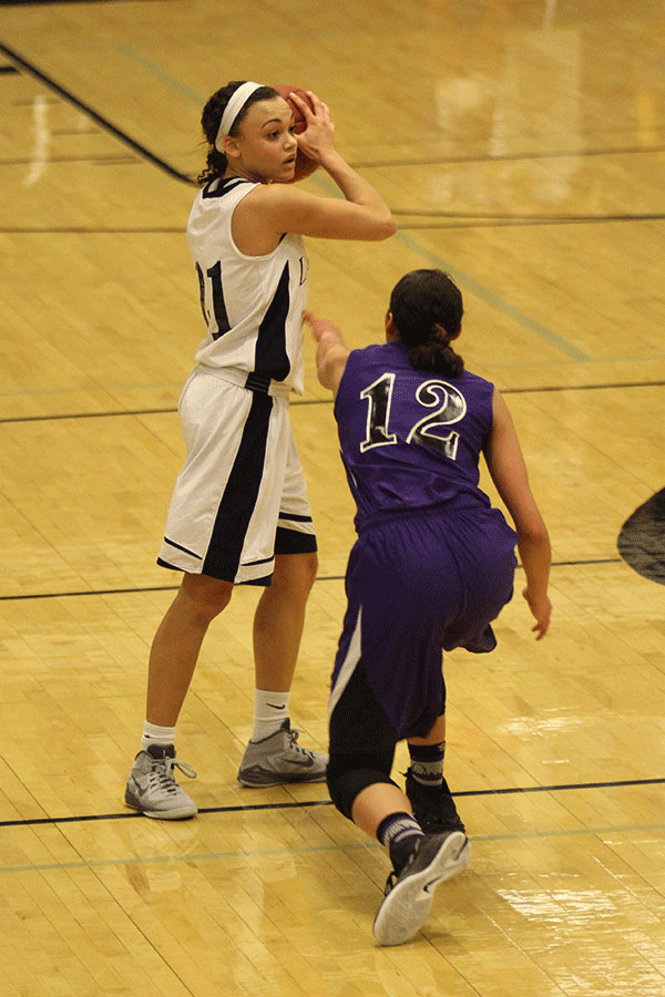 Senior Whitney Haslett looks for an open teammate to pass the ball to.