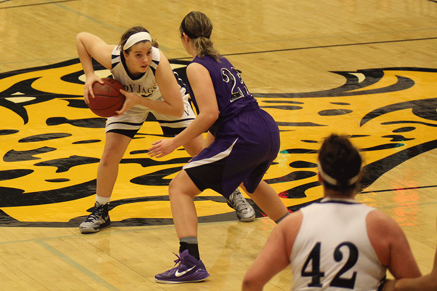 Senior Lacie Myers keeps the ball away from her opponent.