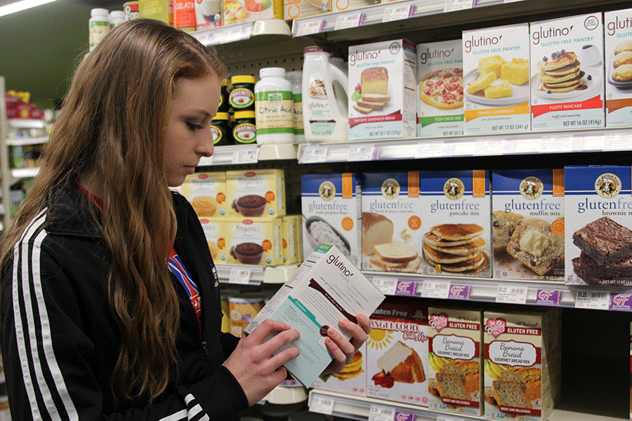 Junior Ellie Wilson shops at Natural Grocers for gluten free cake mix on Friday, Jan. 30. 