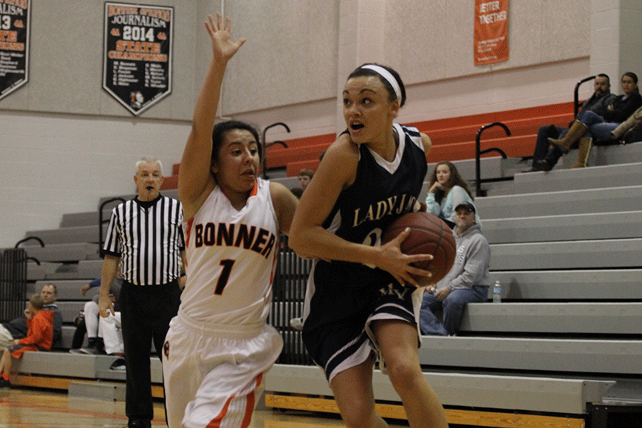 Senior Whitney Hazlett drives to the basket during the basketball game against the Bonner Springs Braves on Tuesday, Feb. 18. The Lady Jaguars defeated the Bonner Springs Braves 48-36.