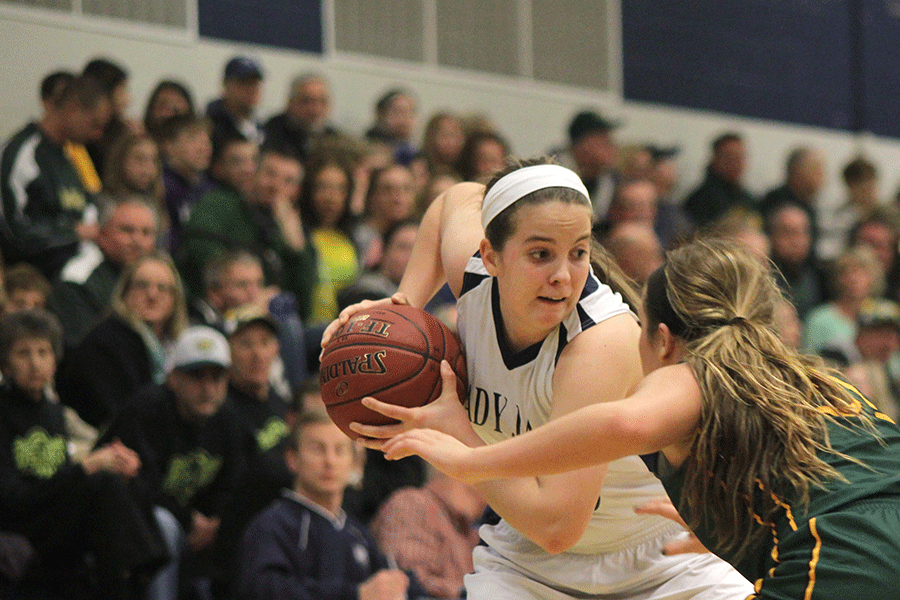 Senior Lacie Myers keeps the ball away from the Basehor Bobcats on Friday, Feb. 27. The Lady Jags defeated the Basehor-Linwood Bobcats 47-36.