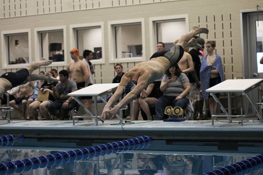 At the boys state swim meet on Saturday, Feb. 21, senior Callahan Eckardt dives to begin his 200 yard freestyle heat, which earned him a sixth place finish. 