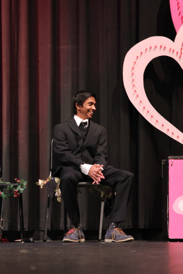 Junior Rohit Biswas watch his fellow contestants model their evening wear.