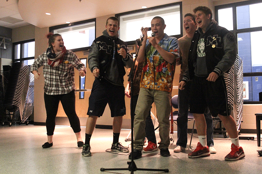 At the end of Open Mic Night, seniors Kaia Minter and Cody Deas and juniors Chase Midyett, Grant Warford and Jack Nielsen sing "Ain't No Mountain High Enough" by Marvin Gaye.
