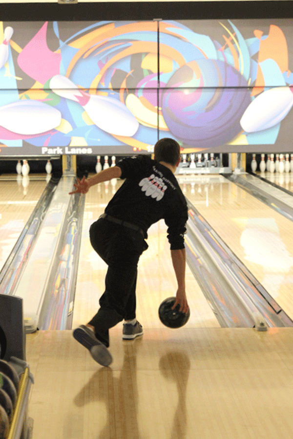 Senior Cody Deas finishes his approach as he rolls the ball down the lane.