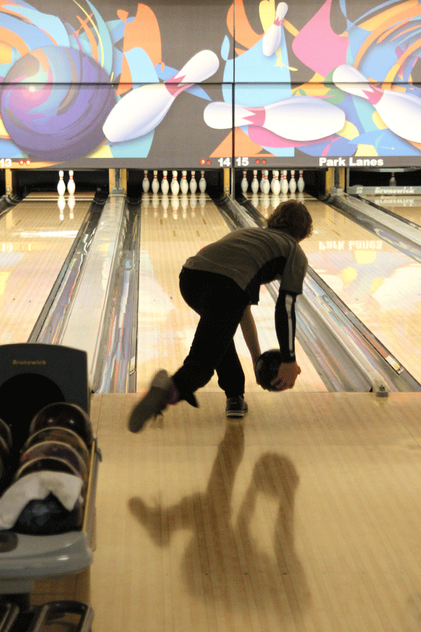 Junior Kole Johnston uses his arm swing to roll the ball down the lane.