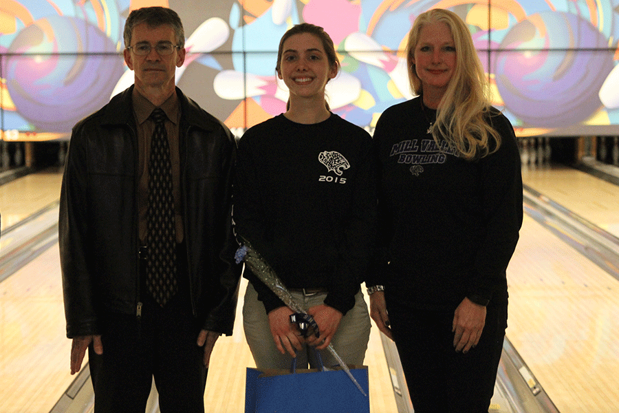 Senior Sarah Hall stands with her parents at Park Lanes on Monday Feb. 2.
