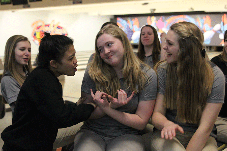 Juniors Camille Gatapia, Isabel Crain and Micaela Crispin celebrate their win against Maranatha and De Soto.