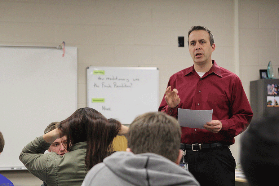 Social studies teacher Jeff Wieland informs students of an upcoming debate in which students will analyze documents and discuss issues from past foreign policies on Friday, January 9.