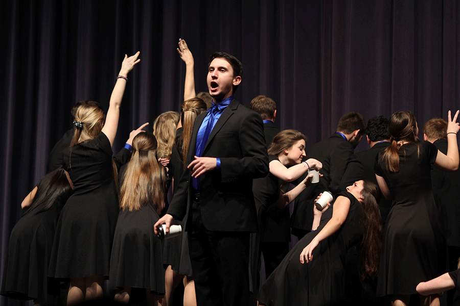 On stage, senior Austin Moores yells his lines at the beginning of the song Coffee.