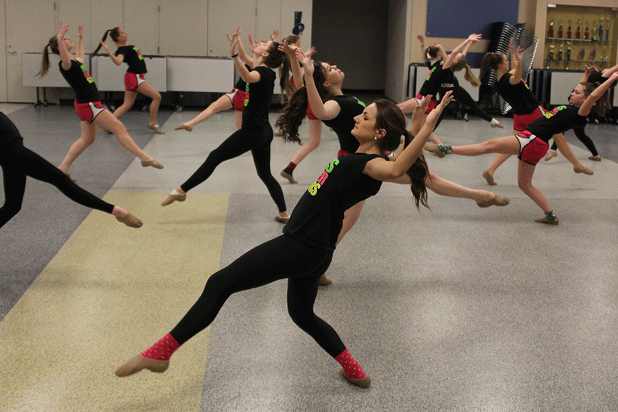 Senior Allison Eigsti practices their routine during a practice on Tuesday, Jan. 20.