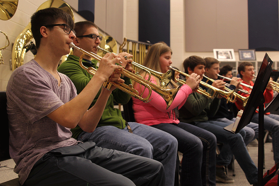 Sophomore+Gabe+Jasso+plays+his+trumpet+to+Folk+Song+Suite+during+band+on+Monday%2C+Feb.+23.+