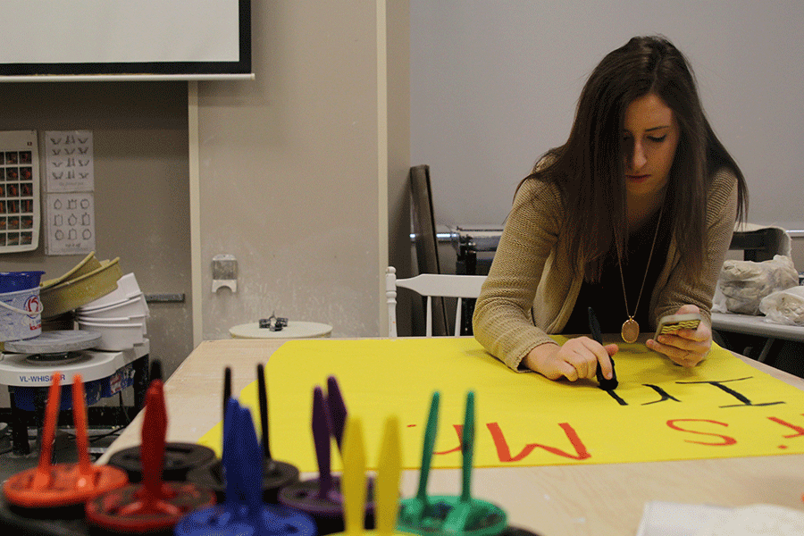Sophomore Riley Doyle creates posters to advertise for Mr. MV during a StuCo meeting on Thursday, Feb. 5. 