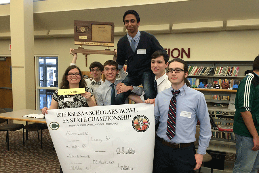 The Quiz Bowl team holds up its 5A state championship trophy and bracket after winning the 5A state competition at Bishop Carroll High School on Saturday, Feb. 14. The team members, from left to right, include senior Katherine White, junior Patrick Gambill, sophomore Tom McClain, junior Rohit Biswas, senior Jack Earlenbaugh and junior Ryan Schwaab.