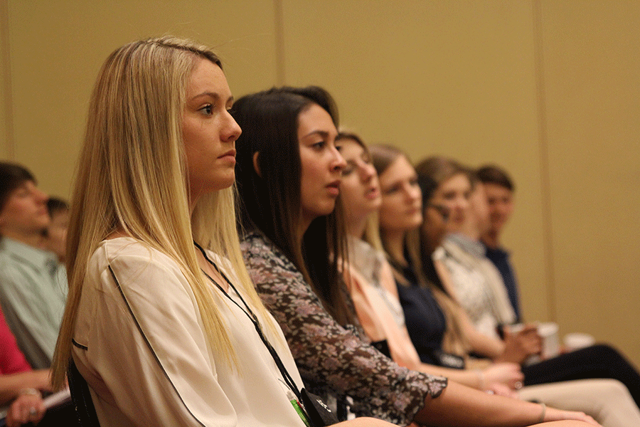 Senior Hannah Hilton listens to DECA candidates at the SCDC DECA competition on Sunday, March. 8. 