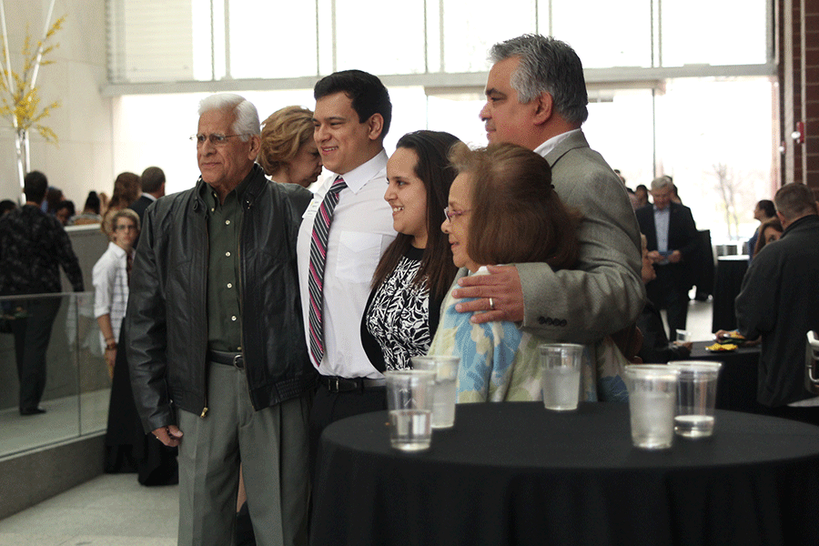 Before the Shooting Stars ceremony began, senior Adam Segura poses for a picture with members of his family.